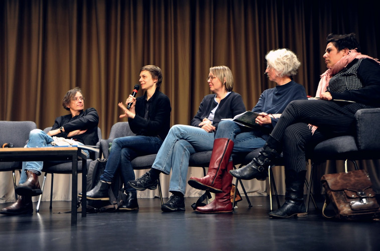 Conversation with five people on stage