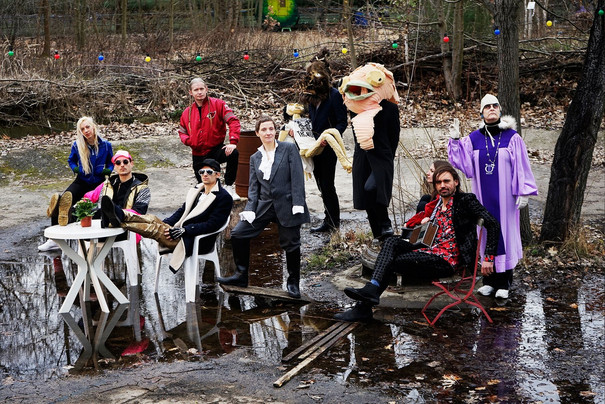 Group of dressed up artists in the rain.