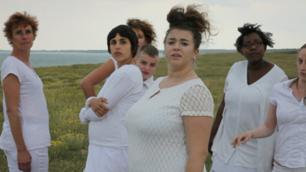 Strong women dressed in white.